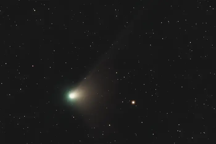 This is the comet C2022 E3 (ZTF) as seen by astronomers in New York via a telescope on January 8, 2023. The greenish glow is its ion tail made of gas.
